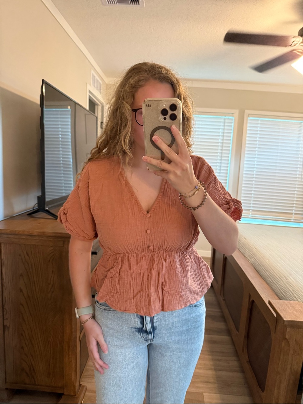 Style Rack rust/orange v-neck blouse with tie-back.
-Size S